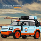 OK 1:18 Scale Die-Cast Alloy Model Toy Compatible with Land Rover Defender - Camel Trophy / Gulf Oil Liveries, with Roof Accessories, Opening Doors, Sound & Light, Shock Absorption, Steering & Horn - Classic Off-Road Collection